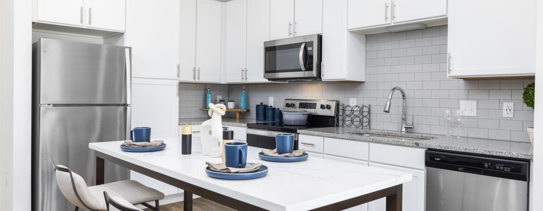 a kitchen with white cabinets