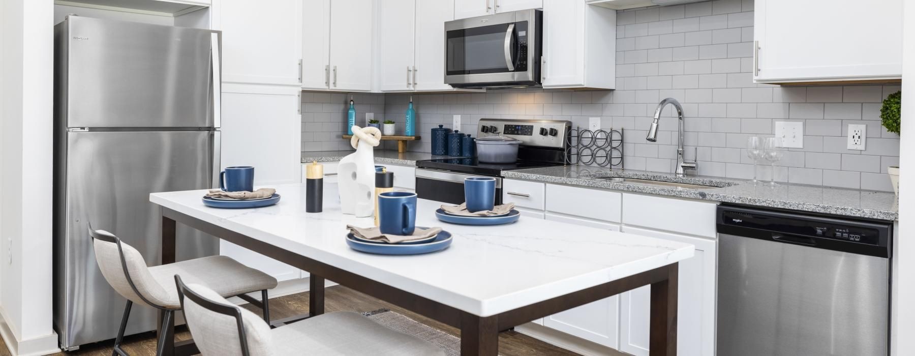 a kitchen with white cabinets