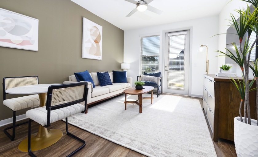 living room with couch coffee table and windows