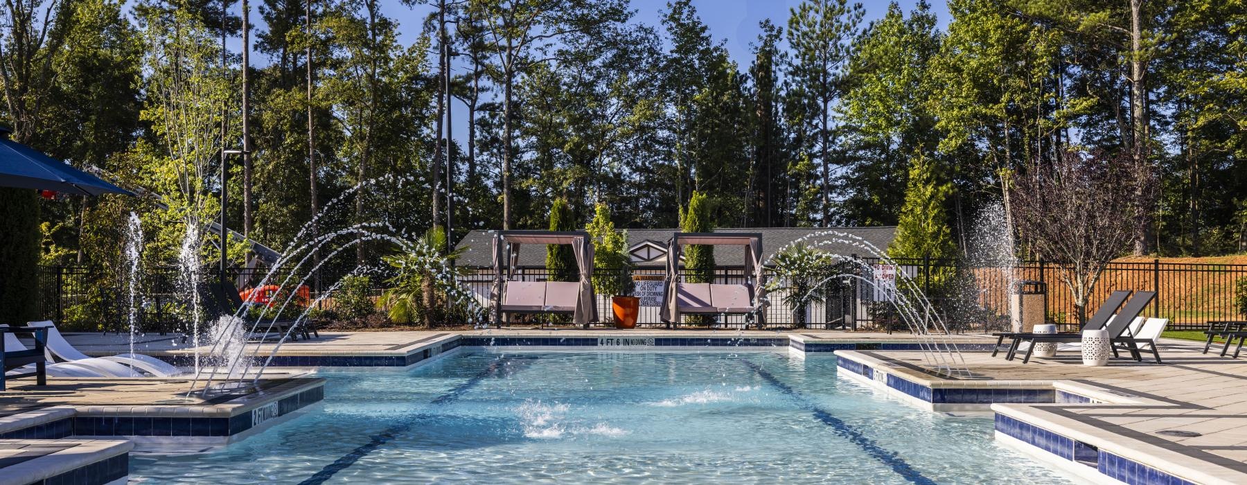 a swimming pool with a fountain