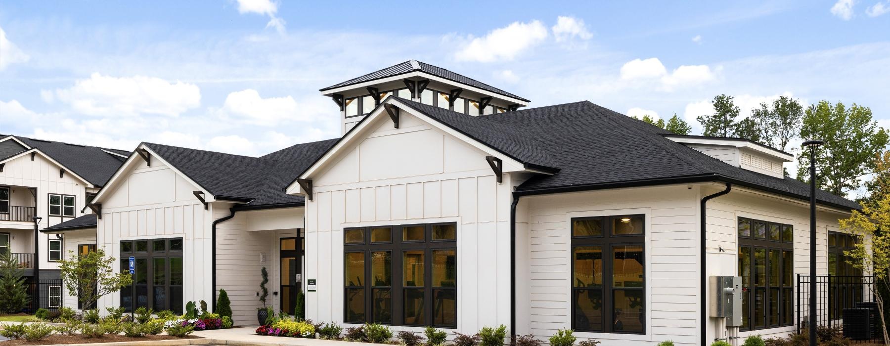 a white building with a parking lot